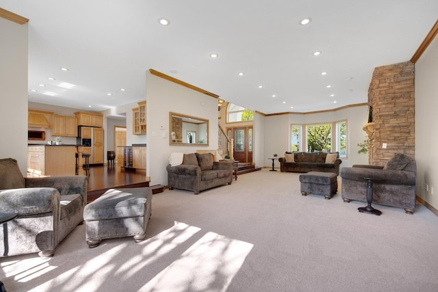 carpeted living room featuring recessed lighting, baseboards, and crown molding