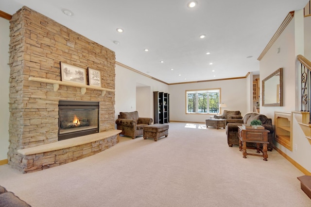 carpeted living area featuring baseboards, ornamental molding, recessed lighting, and a fireplace