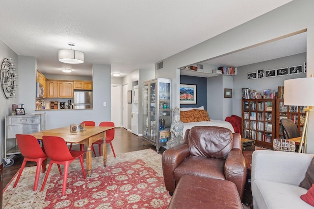 1425 28th St Unit 407, Minneapolis, MN 55408 - living area with dark wood-style flooring and a textured ceiling