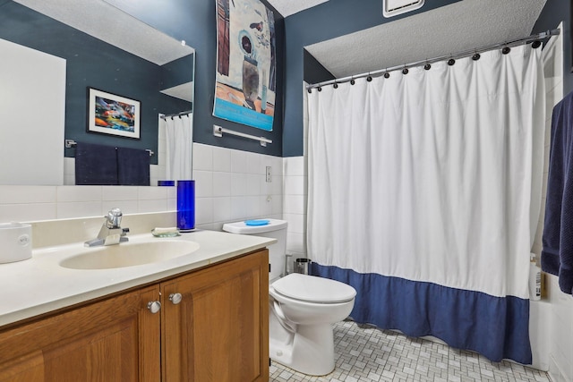 1425 28th St Unit 407, Minneapolis, MN 55408 - bathroom with vanity, toilet, curtained shower, tile walls, and tile patterned floors