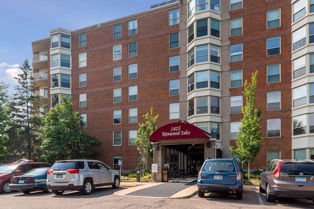 1425 28th St Unit 407, Minneapolis, MN 55408 - view of apartment building / complex featuring uncovered parking