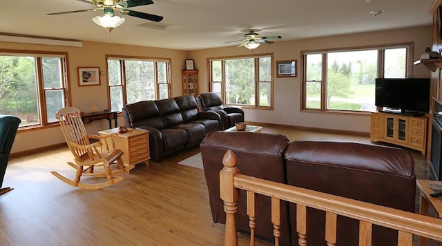 44172 Mosquito Heights Rd, Perham, MN 56573 - living room with ceiling fan, light wood-style floors, and baseboards