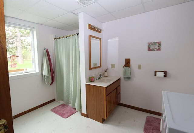 44172 Mosquito Heights Rd, Perham, MN 56573 - bathroom featuring a drop ceiling, vanity, a shower with shower curtain, and baseboards