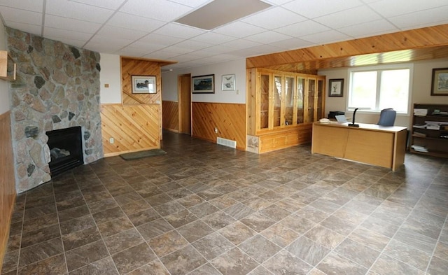 44172 Mosquito Heights Rd, Perham, MN 56573 - office featuring wooden walls, a paneled ceiling, stone finish floors, wainscoting, and a fireplace