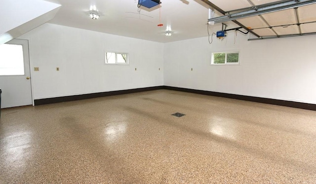44172 Mosquito Heights Rd, Perham, MN 56573 - garage featuring a garage door opener and baseboards
