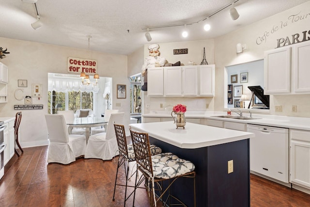 2499 Lockwood Dr Unit 61, Mendota Heights, MN 55120 - kitchen featuring white dishwasher, track lighting, a kitchen island, and white cabinets