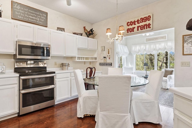 2499 Lockwood Dr Unit 61, Mendota Heights, MN 55120 - kitchen with stainless steel appliances, a chandelier, white cabinetry, and light countertops