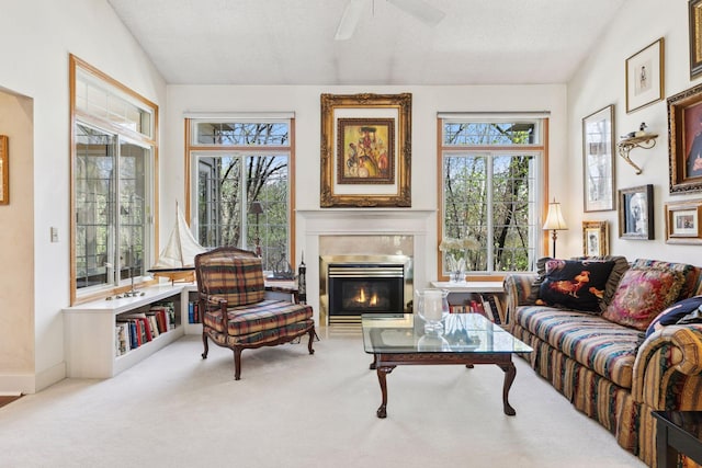 2499 Lockwood Dr Unit 61, Mendota Heights, MN 55120 - carpeted living area featuring plenty of natural light, a ceiling fan, lofted ceiling, and a fireplace