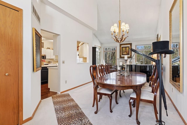 2499 Lockwood Dr Unit 61, Mendota Heights, MN 55120 - dining area with a chandelier, light colored carpet, and vaulted ceiling