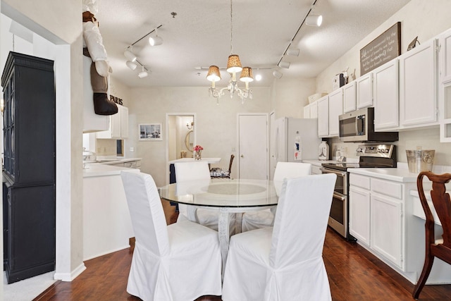2499 Lockwood Dr Unit 61, Mendota Heights, MN 55120 - dining area featuring track lighting, a chandelier, and dark wood-type flooring