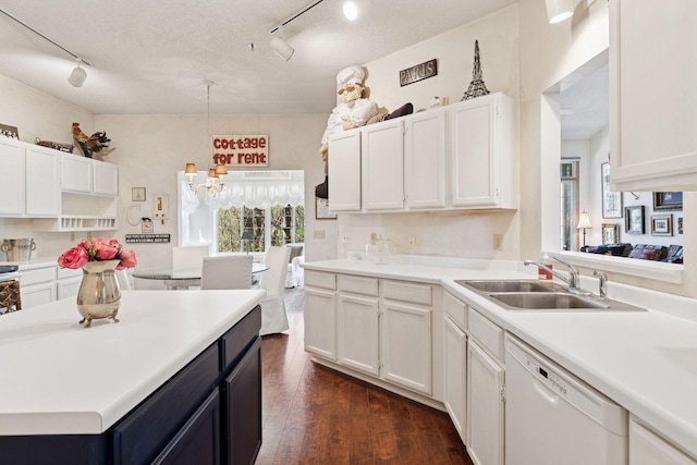 2499 Lockwood Dr Unit 61, Mendota Heights, MN 55120 - kitchen with white dishwasher, rail lighting, white cabinets, and light countertops