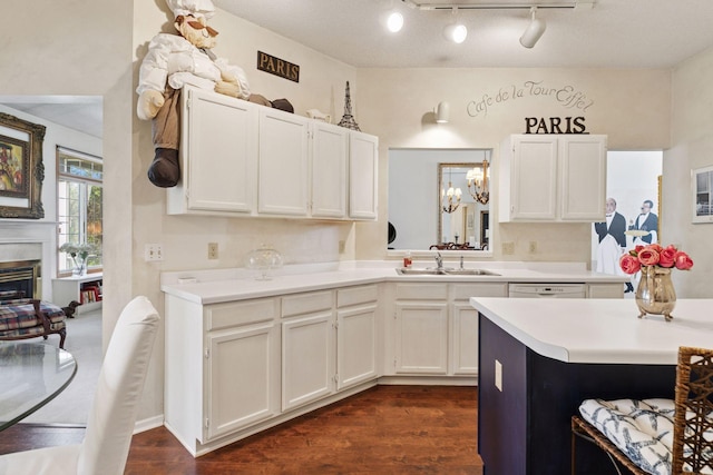 2499 Lockwood Dr Unit 61, Mendota Heights, MN 55120 - kitchen featuring light countertops, dark wood-type flooring, white cabinets, and white dishwasher