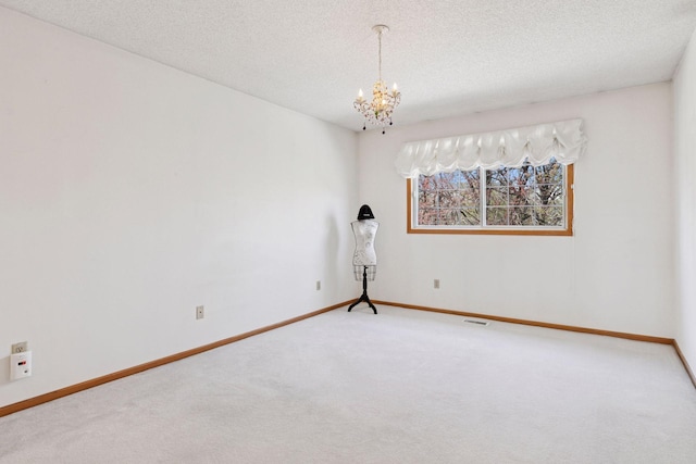 2499 Lockwood Dr Unit 61, Mendota Heights, MN 55120 - carpeted empty room featuring a chandelier and a textured ceiling