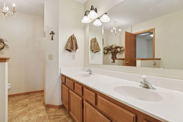 2499 Lockwood Dr Unit 61, Mendota Heights, MN 55120 - bathroom with a chandelier and double vanity