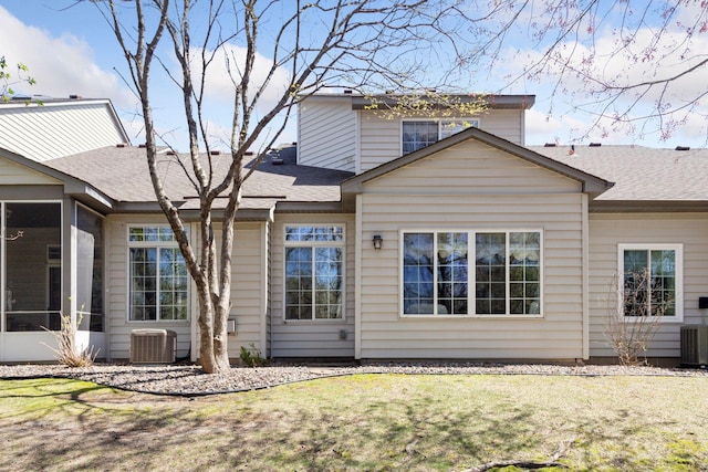 2499 Lockwood Dr Unit 61, Mendota Heights, MN 55120 - back of house with a sunroom, a yard, and roof with shingles