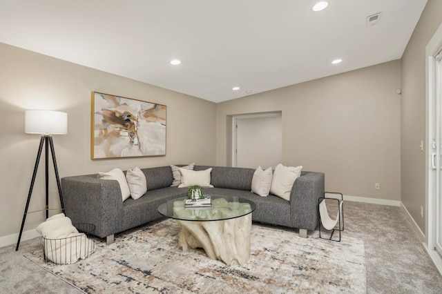 living area featuring baseboards, carpet flooring, and recessed lighting