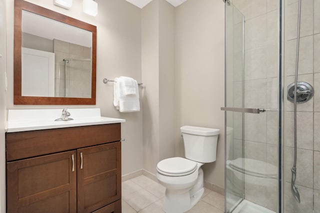 full bathroom with tile patterned flooring, vanity, toilet, baseboards, and a stall shower