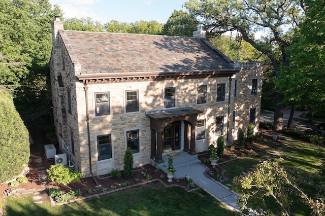 4649 Lake Harriet Pkwy, Minneapolis, MN 55419 - view of front of home with a chimney, a high end roof, and stone siding