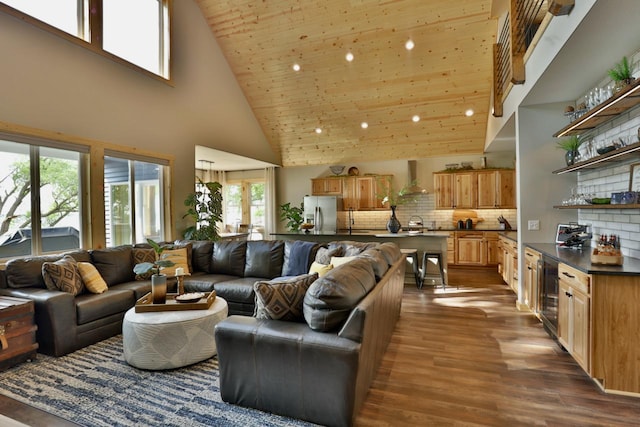 living room with high vaulted ceiling, beverage cooler, dark wood finished floors, wooden ceiling, and recessed lighting