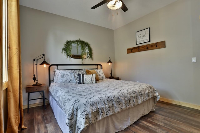 bedroom with wood finished floors, baseboards, and ceiling fan