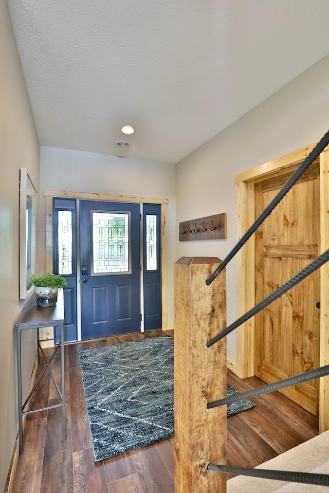 entryway featuring wood finished floors and recessed lighting