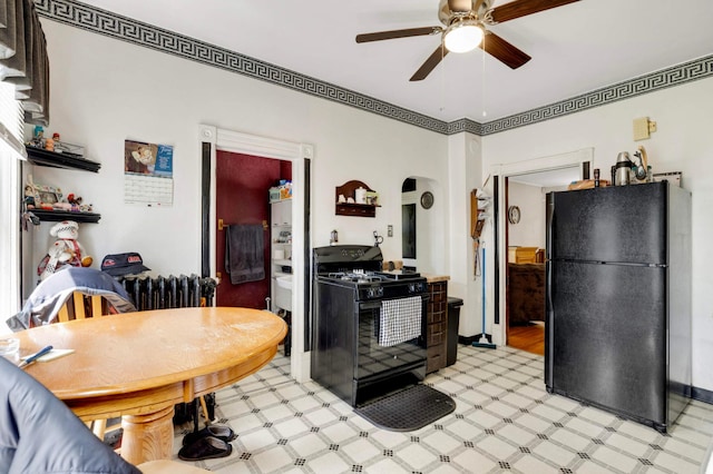 1102 Pacific St, Saint Paul, MN 55106 - kitchen with black appliances, light flooring, ceiling fan, and arched walkways