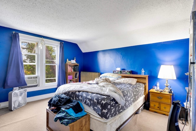 1102 Pacific St, Saint Paul, MN 55106 - carpeted bedroom featuring a textured ceiling, radiator heating unit, lofted ceiling, and baseboards