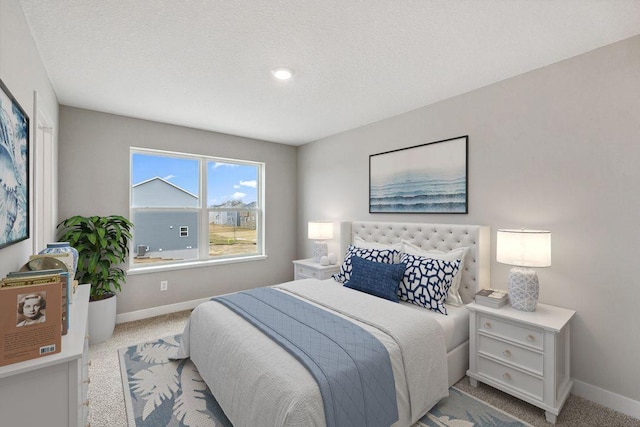 carpeted bedroom featuring baseboards