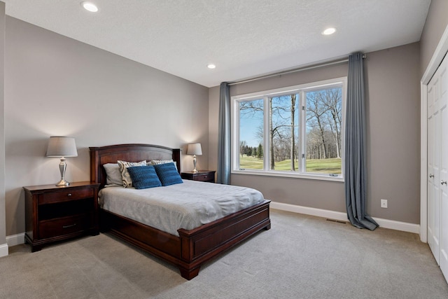 5610 Burl Oaks Ct, Minnetrista, MN 55364 - bedroom with light carpet, recessed lighting, baseboards, and a textured ceiling