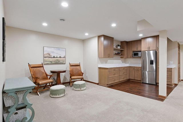 5610 Burl Oaks Ct, Minnetrista, MN 55364 - kitchen featuring stainless steel appliances, open shelves, dark carpet, recessed lighting, and light countertops