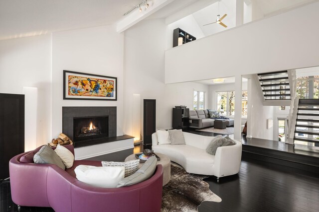 3710 Vincent Ave S, Minneapolis, MN 55410 - living area featuring stairs, a lit fireplace, beam ceiling, high vaulted ceiling, and ceiling fan