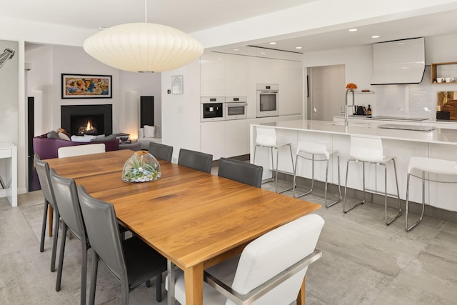 3710 Vincent Ave S, Minneapolis, MN 55410 - dining space featuring a lit fireplace and recessed lighting
