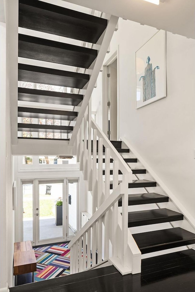 3710 Vincent Ave S, Minneapolis, MN 55410 - stairway featuring french doors and a towering ceiling