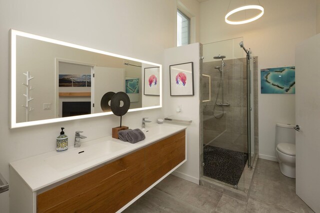 3710 Vincent Ave S, Minneapolis, MN 55410 - full bathroom featuring a shower stall, toilet, double vanity, baseboards, and tile patterned floors