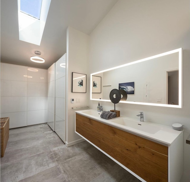 3710 Vincent Ave S, Minneapolis, MN 55410 - full bathroom with a skylight, double vanity, and vaulted ceiling