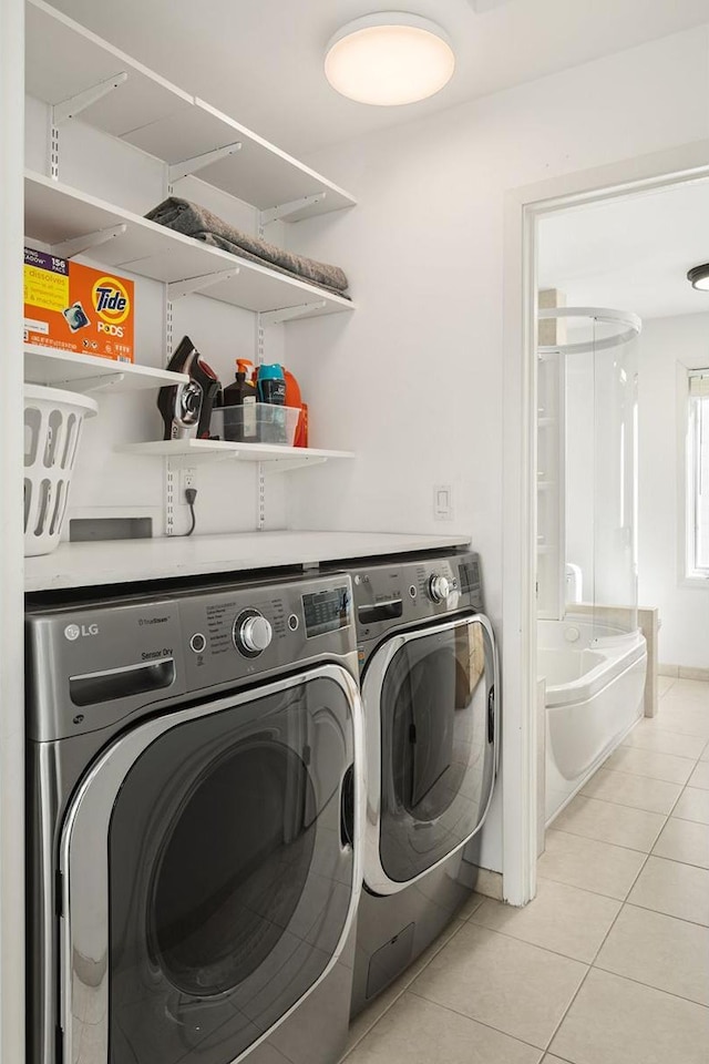 3710 Vincent Ave S, Minneapolis, MN 55410 - clothes washing area featuring independent washer and dryer and light tile patterned floors