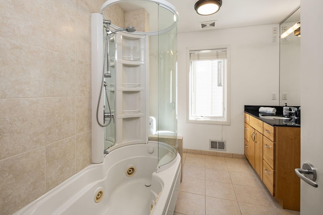 3710 Vincent Ave S, Minneapolis, MN 55410 - bathroom with an enclosed shower, tile patterned flooring, a tub with jets, and vanity