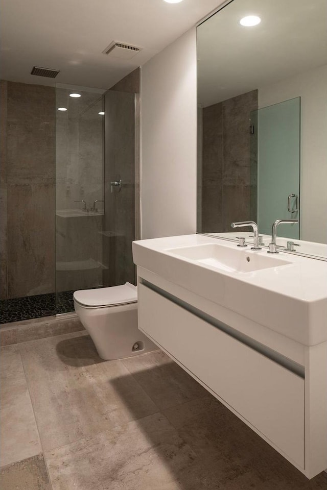 3710 Vincent Ave S, Minneapolis, MN 55410 - bathroom featuring a shower stall, toilet, recessed lighting, and vanity