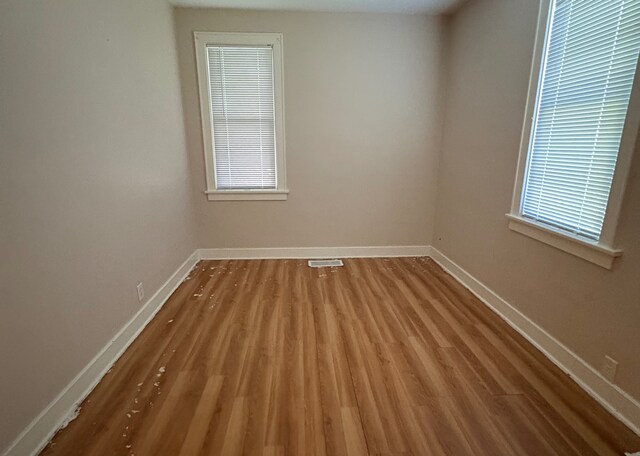 529 Blair Ave, Saint Paul, MN 55103 - spare room with wood finished floors and healthy amount of natural light