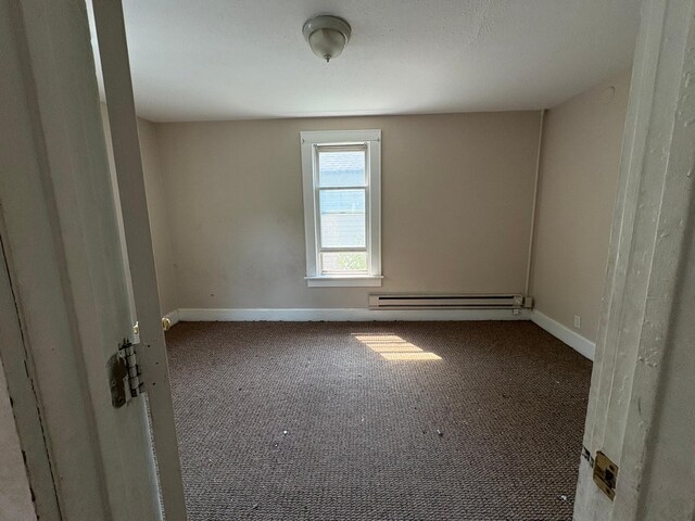 529 Blair Ave, Saint Paul, MN 55103 - carpeted empty room featuring a baseboard heating unit and baseboards