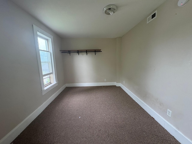 529 Blair Ave, Saint Paul, MN 55103 - unfurnished room featuring baseboards and dark carpet