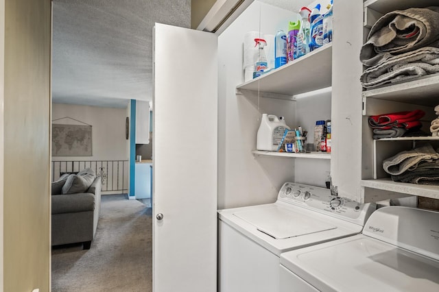 washroom with carpet floors, laundry area, a textured ceiling, and washing machine and clothes dryer