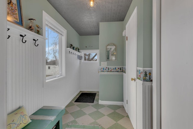1205 Melvina Rd SW, Alexandria, MN 56308 - mudroom featuring light floors, baseboards, and wainscoting