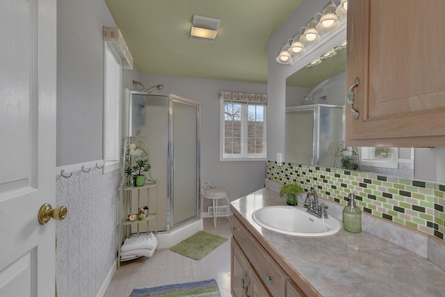 1205 Melvina Rd SW, Alexandria, MN 56308 - bathroom featuring vanity, tasteful backsplash, and a shower stall