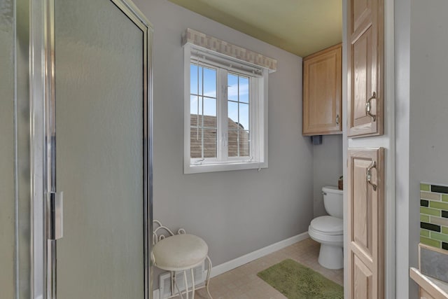 1205 Melvina Rd SW, Alexandria, MN 56308 - full bathroom with an enclosed shower, baseboards, toilet, and visible vents