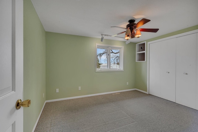 1205 Melvina Rd SW, Alexandria, MN 56308 - unfurnished bedroom featuring baseboards, a ceiling fan, carpet, and a closet