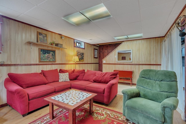 1205 Melvina Rd SW, Alexandria, MN 56308 - living room featuring a drop ceiling, wood finished floors, and wooden walls