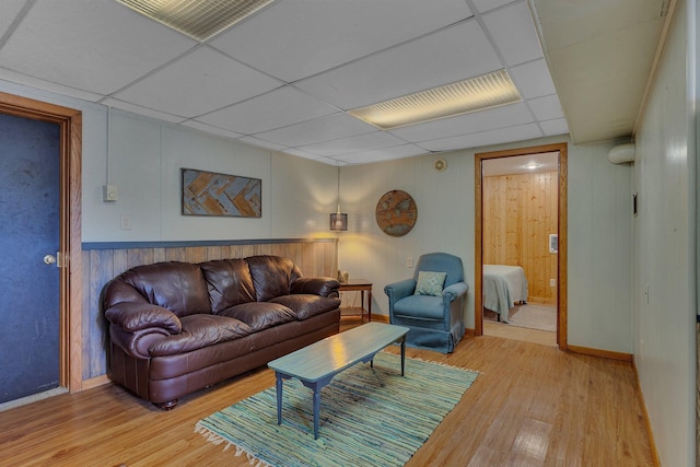 1205 Melvina Rd SW, Alexandria, MN 56308 - living area with baseboards, light wood finished floors, and a paneled ceiling