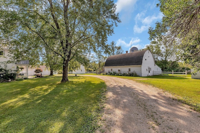 1205 Melvina Rd SW, Alexandria, MN 56308 - exterior space with fence, a yard, a chimney, a barn, and an outbuilding
