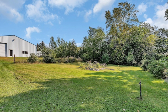 1205 Melvina Rd SW, Alexandria, MN 56308 - view of yard featuring an outdoor structure, a garage, and a pole building